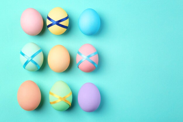 Decorated Easter eggs on color background