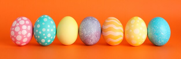 Decorated Easter eggs on color table.