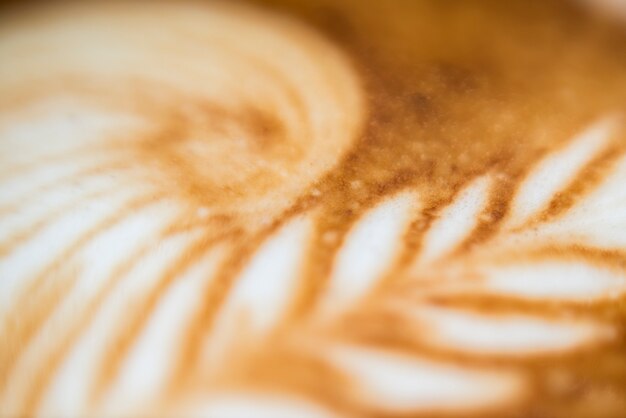 Decorated froth in tasty coffee