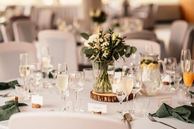 Decorated hall for wedding ceremony Wedding Banquet The chairs and round table for guests served with cutlery flowers