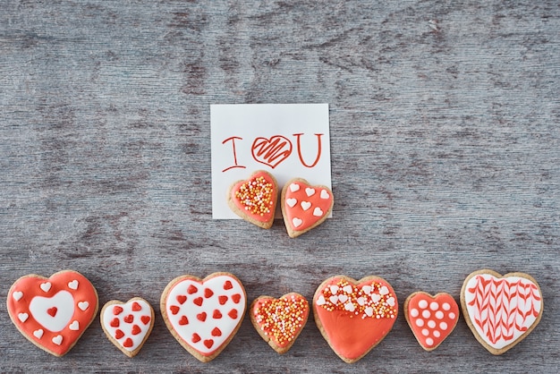 Decorated heart shape cookies and paper sheet