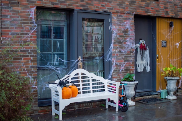 Decorated house for Halloween with cobwebs and pumpkins