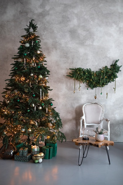 decorated living room loft  interior with armchair wooden coffe table and christmas tree with gift