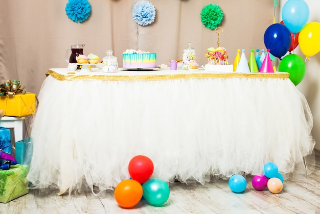 Decorated table in the room for Happy Birthday Party without people