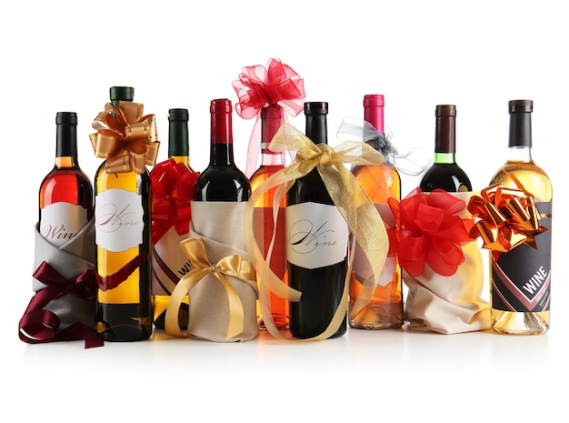 Decorated wine bottles on white background