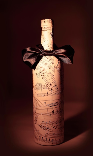 Decorated with the gift of a bottle Isolated on a brown background