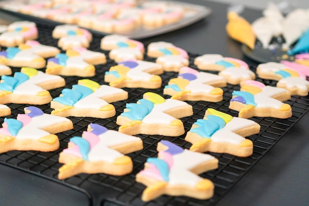 Decorating unicorn themed sugar cookies with royal icing.