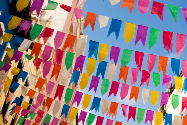 decoration colorful pennants sao joao party against blue sky