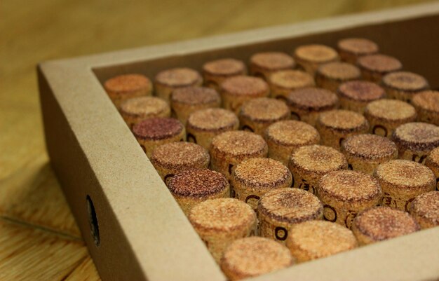 Decoration concept of wine corks lined up in a cardboard box angle view stock photo