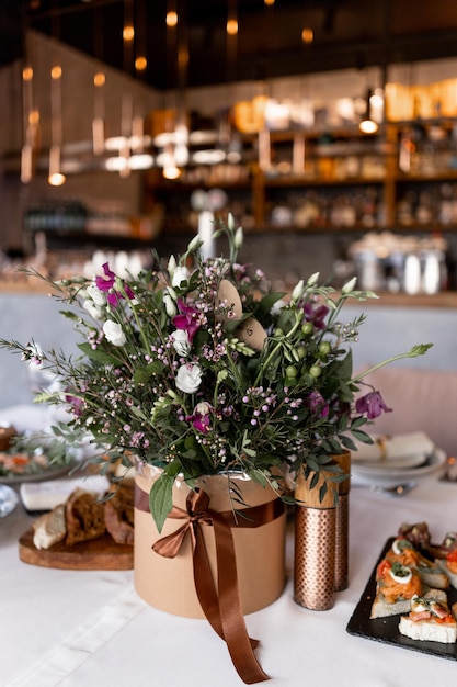 Decoration of flowers on the table in the restaurant at the wedding