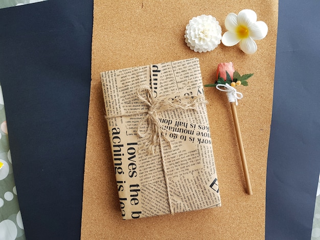 Decoration gift wrap with brown craft paper and wooden pencil 