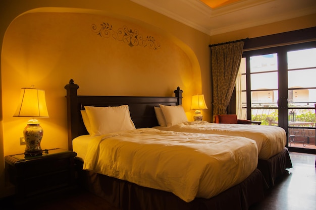 Decoration of hotel room with comfortable bed