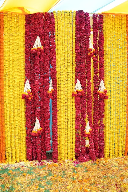 Photo decoration of red yellow flower in indian wedding. shallow depth of field, or blur.
