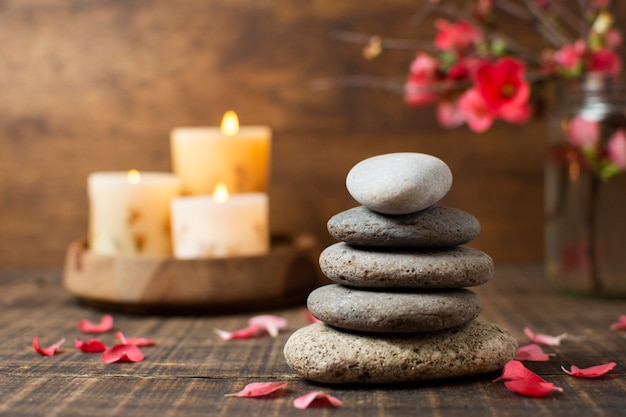 Decoration with spa stones and lit candles