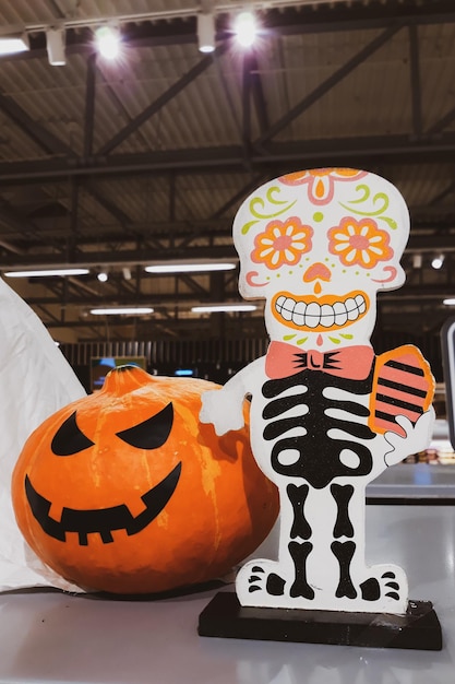 Decorations for Halloween and Day of the Dead in Mexico Skeleton and fresh pumpkins Scary decor to celebrate Dia Los Muertos