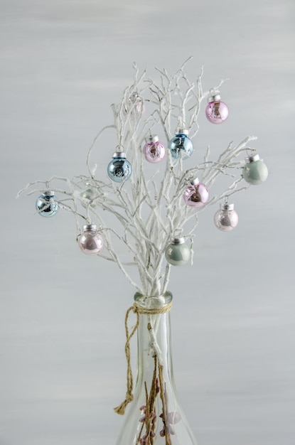 Decorations New Year Christmas balls on white branches with copy space