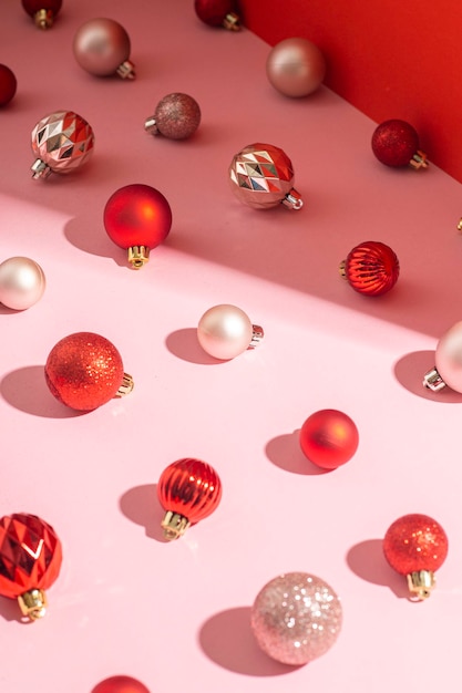 Decorative balls on a pink background Christmas and New Year concept