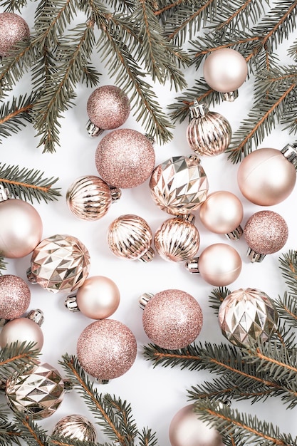 Decorative balls and sprigs of fir on a white background Top view flat lay