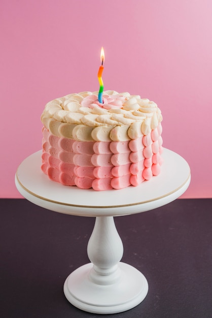 Decorative birthday cake on cakestand