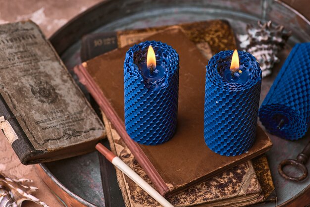 Decorative blue candles made of beeswax with a honey aroma for interior and tradition.