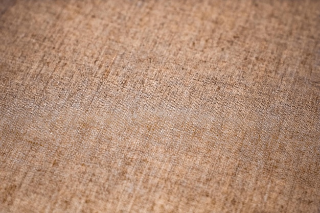 Decorative brown linen fabric textured background for interior furniture design and art canvas backdrop