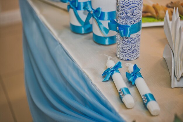 Decorative candles decorated with blue ribbons 732