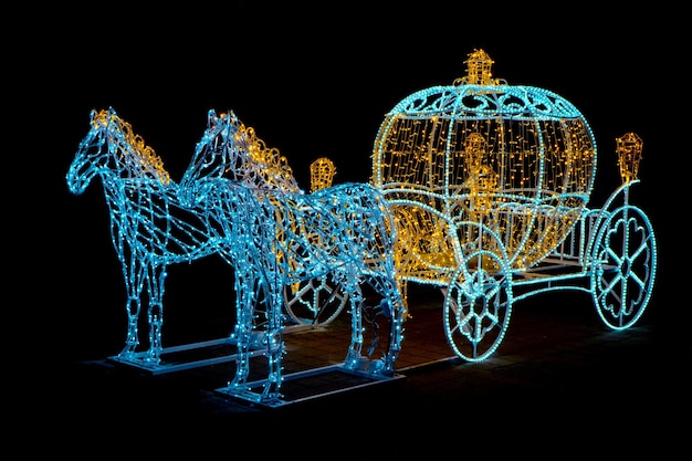 Decorative carriage with horses decorated with lights. Crismas. New year