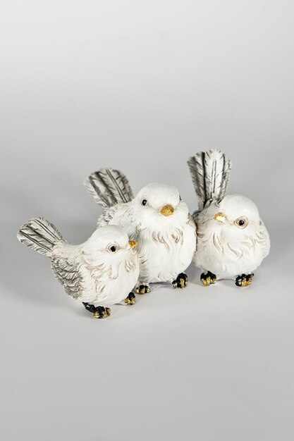 Decorative ceramic birds figurine on white background