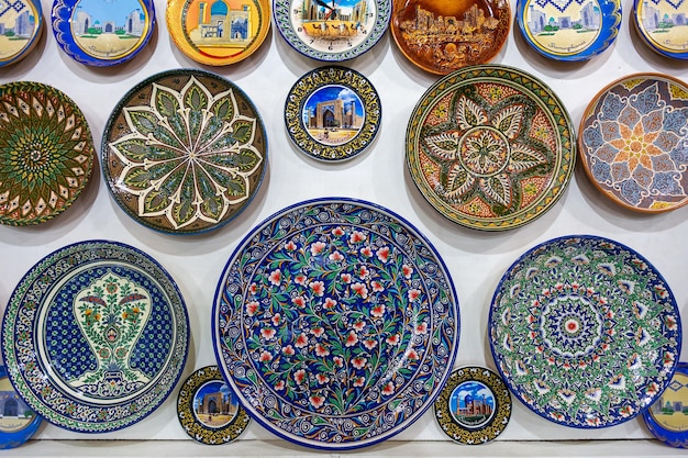 Decorative ceramic plates with traditional Uzbek ornaments in the Samarkand market. Uzbekistan