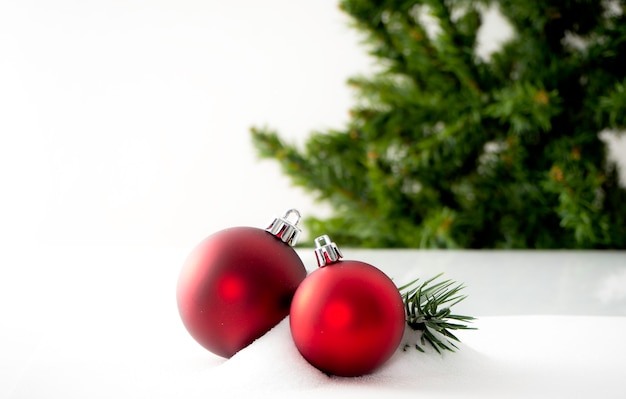 Decorative Christmas ornaments on a snowy surface