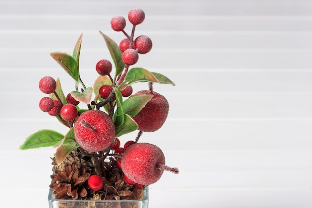 Decorative composition of artificial apples and berries