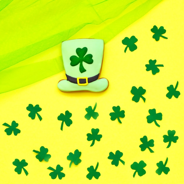 Decorative cookie on yellow. St. Patrick's Day concept