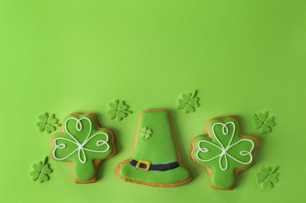 Decorative cookies on green background Saint Patrics Day concept