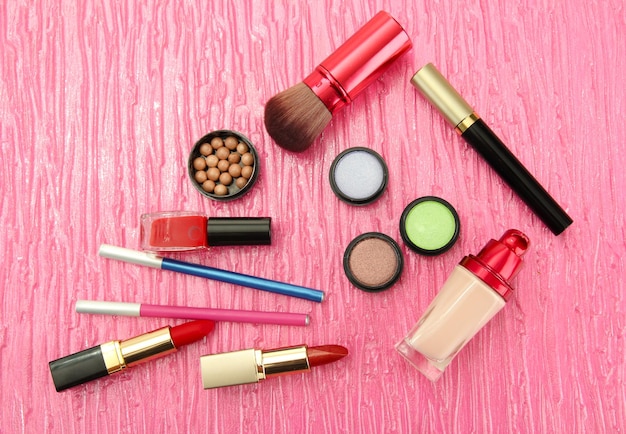 Decorative cosmetics on pink background