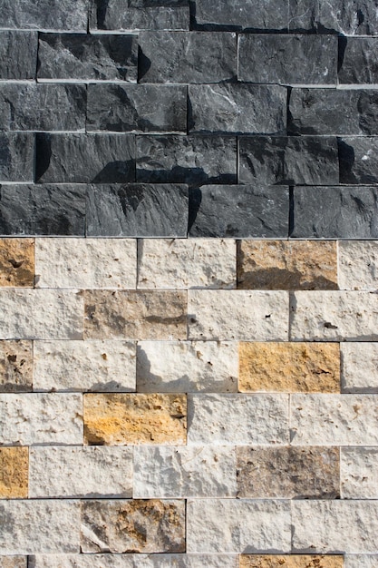 Декоративная кубическая каменная стена в качестве фоновой текстуры