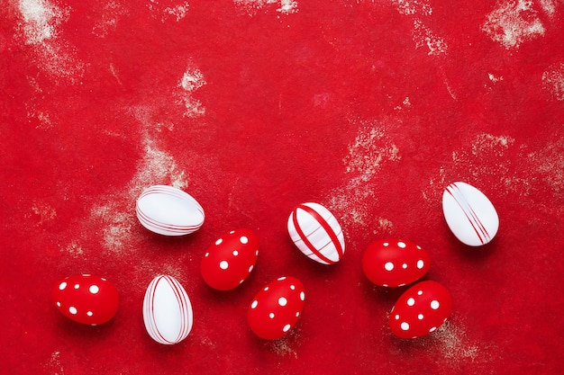 Decorative Easter eggs on a bright red background