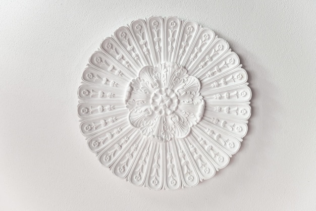 Decorative element of design stucco molding on the ceiling