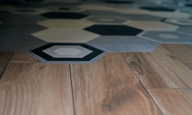 Фото Декоративный орнамент моды узор плитки на полу в европе. деревянный паркетный зал. минималистичный дизайн интерьера. стильная кухня. скандинавский стиль.