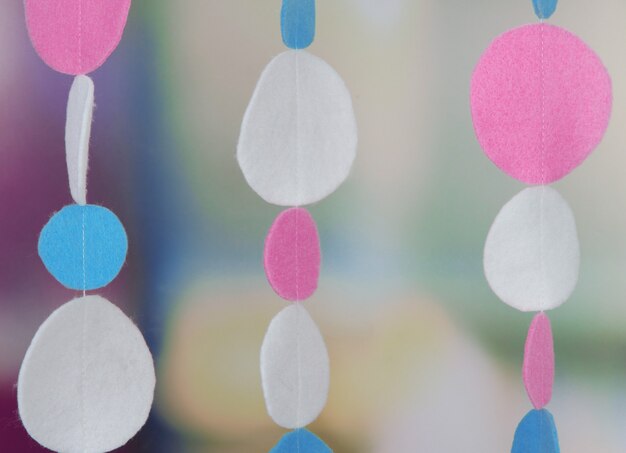 Decorative felt garland on bright background