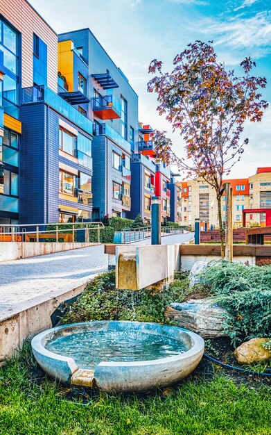 Decorative fountain at Modern complex of apartment residential buildings. With outdoor facilities.