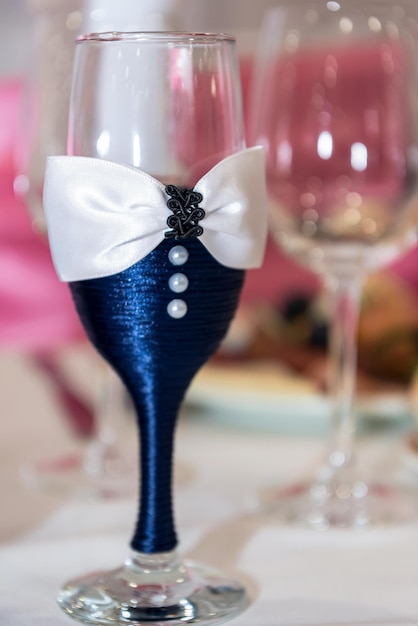 Decorative glass of champagne for the groom