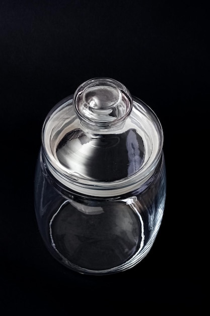 Decorative glass jar on a black background