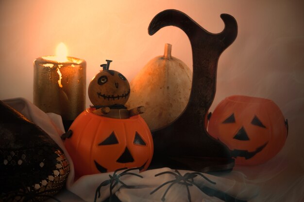 Decorative Halloween still life with pumpkins skulls spiders and candles Copy space