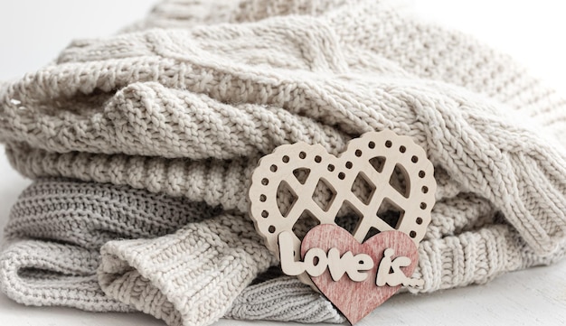 A decorative heart among cozy knitted items valentines day holiday concept