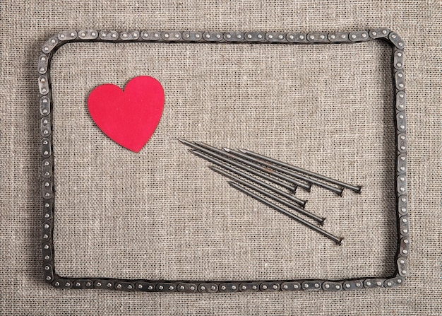 Decorative heart and the nails in bicycle chain frame