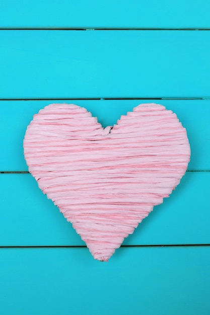 Decorative heart on wooden background