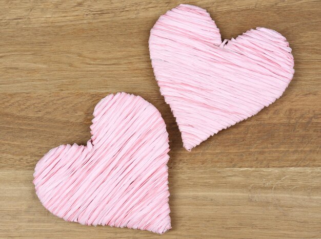 Decorative heart on wooden background