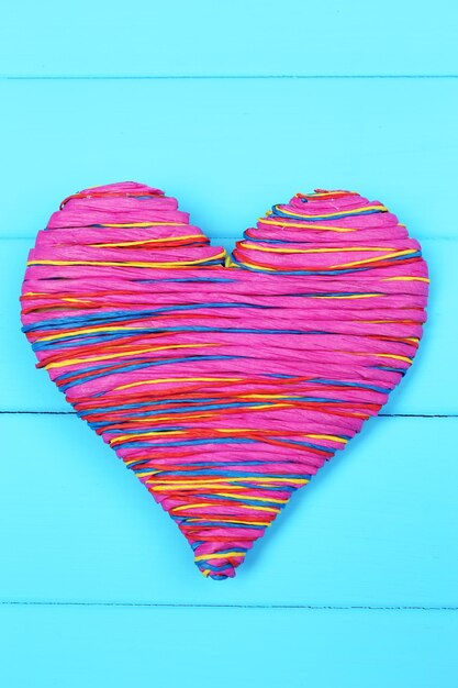 Decorative heart on wooden background