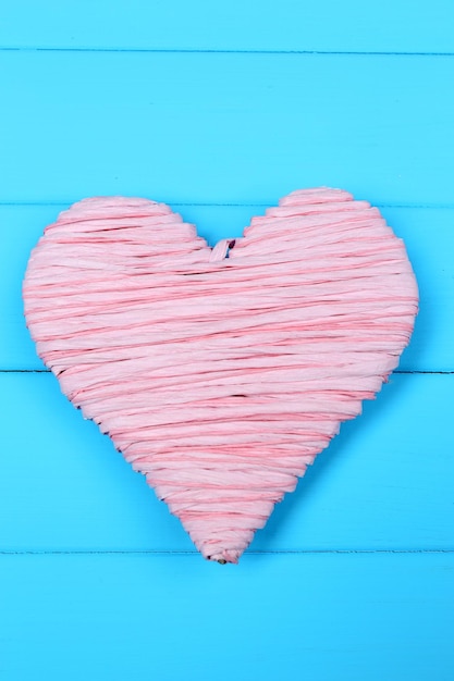 Decorative heart on wooden background