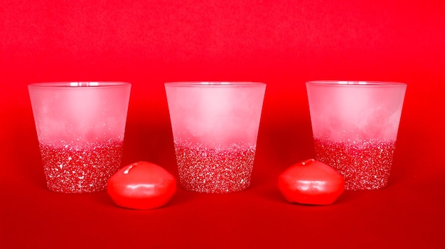 Photo decorative home objects candle holders on the red background for home interior design